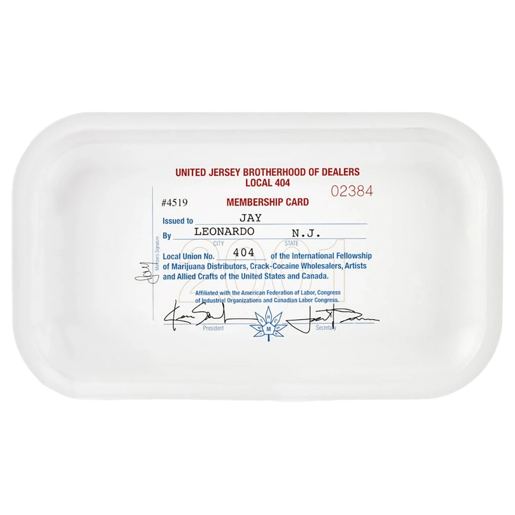 Top-down view of a white JSB Signature Tray-Medium with a vintage membership-card graphic printed in red and blue centered on its flat surface.