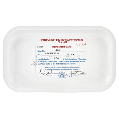 Top-down view of a white JSB Signature Tray-Medium with a vintage membership-card graphic printed in red and blue centered on its flat surface.