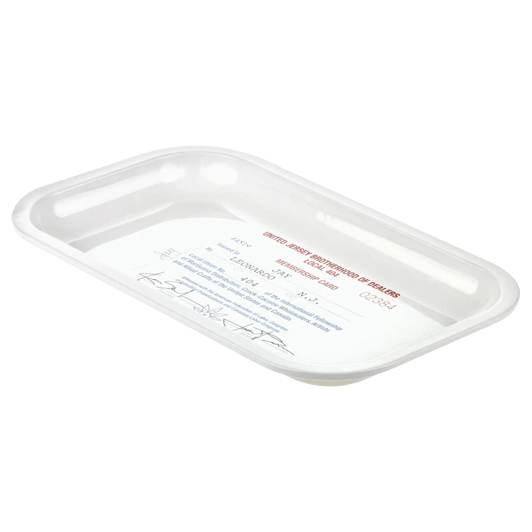 Angled top-down view of a white JSB Signature Tray-Medium showing a shallow rectangular basin with rounded corners and printed text inside.