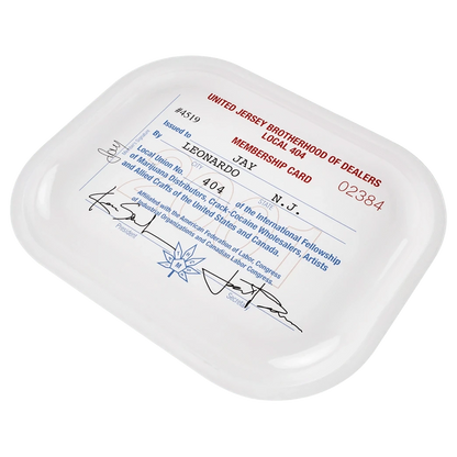 Angled top-down view of the white JSB Signature Tray-Small featuring a vintage red and blue "United Jersey Brotherhood of Dealers" membership card print.
