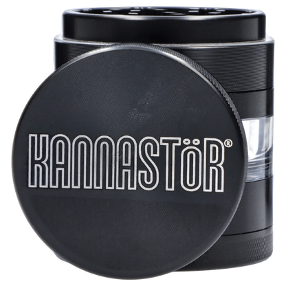 Close-up of the black Kannastör Jar Body Grinder 2.2, highlighting its textured metal exterior and cylindrical shape.