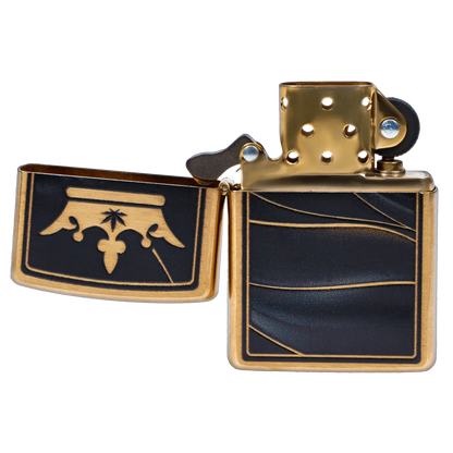 Close-up, three-quarter view of the opened Queen of Bud Zippo Black Obsidian Midnight Manifest lighter showing gold hardware and black panels with gold-lined wave and fleur-de-lis motifs