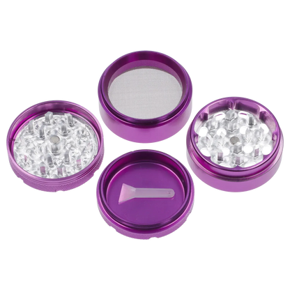 Top-down view of the disassembled purple Puff Puff Pass Aluminum Grinder 4pc -Purple-50mm showing its four anodized sections, mesh screen, teeth, and small plastic scraper.