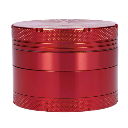 Close-up of the red, 62mm Puff Puff Pass Aluminum 4pc Grinder, showing its textured, four-piece construction.