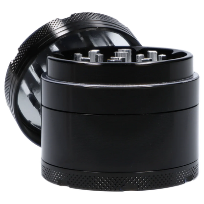 Close-up angled shot of the Famous X 4 pc Grinder -Black - 50mm showing the open top teeth and textured black outer ring.