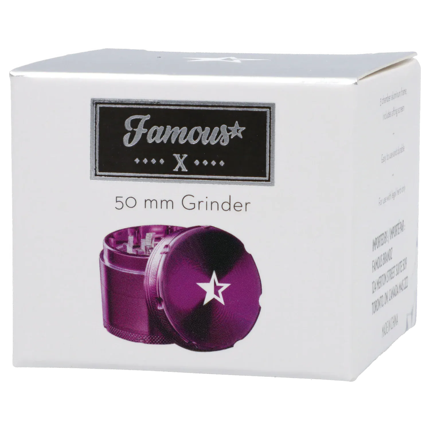 Angled front view of the Famous X 4 pc Grinder -Purple - 50mm packaging showing a purple grinder with a white star on its lid against a white box.