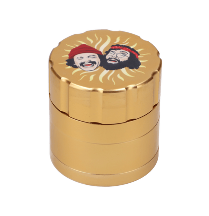 A front view of the gold C&C Grinder 40th, showing its stacked cylindrical design with ridged detailing.