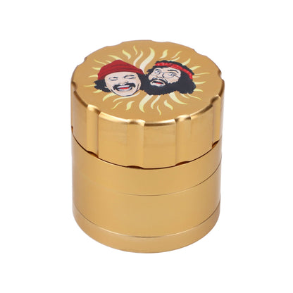 Front view of the gold C&C Grinder 40th, featuring a multi-tiered cylindrical design with visible ridges and a metallic sheen.