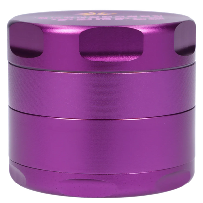 Close-up front view of the metallic purple Puff Puff Pass Strains Granddaddy Grinder-Purple showing its stacked cylindrical sections and recessed grip notches.