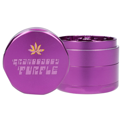 Close-up front and side view of the metallic purple Puff Puff Pass Strains Granddaddy Grinder-Purple showing embossed "Granddaddy Purple" text and a gold leaf logo.