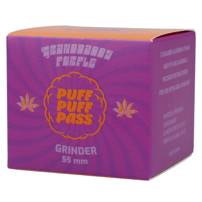 Angled close-up of the purple Puff Puff Pass Strains Granddaddy Grinder-Purple box showing orange logo text and 55 mm grinder labeling.