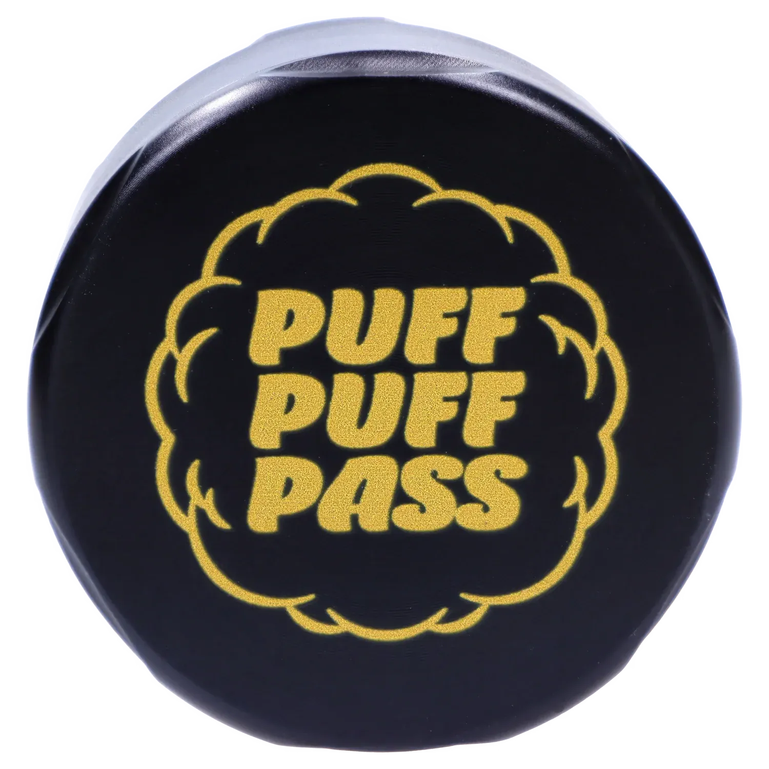 Top-down view of the black Puff Puff Pass Strains OG Kush Grinder-Black showing a gold "PUFF PUFF PASS" puff-shaped logo centered on the lid.