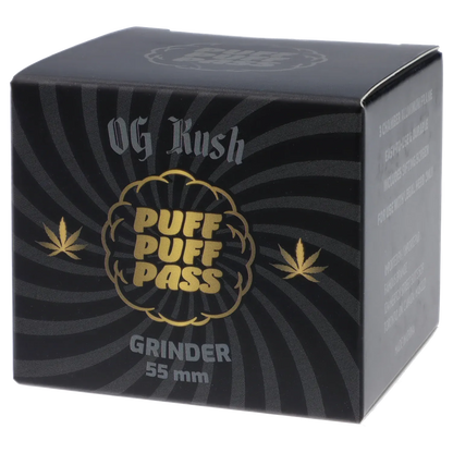 Angled front view of the black Puff Puff Pass Strains OG Kush Grinder-Black box with gold logo and radial stripe pattern.