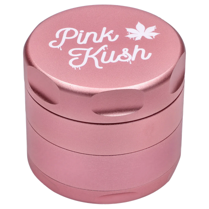 Top-down view of the Puff Puff Pass Strains Pink Kush Grinder-Light Pink showing its metallic pink stacked chambers and white "Pink Kush" script on the lid.
