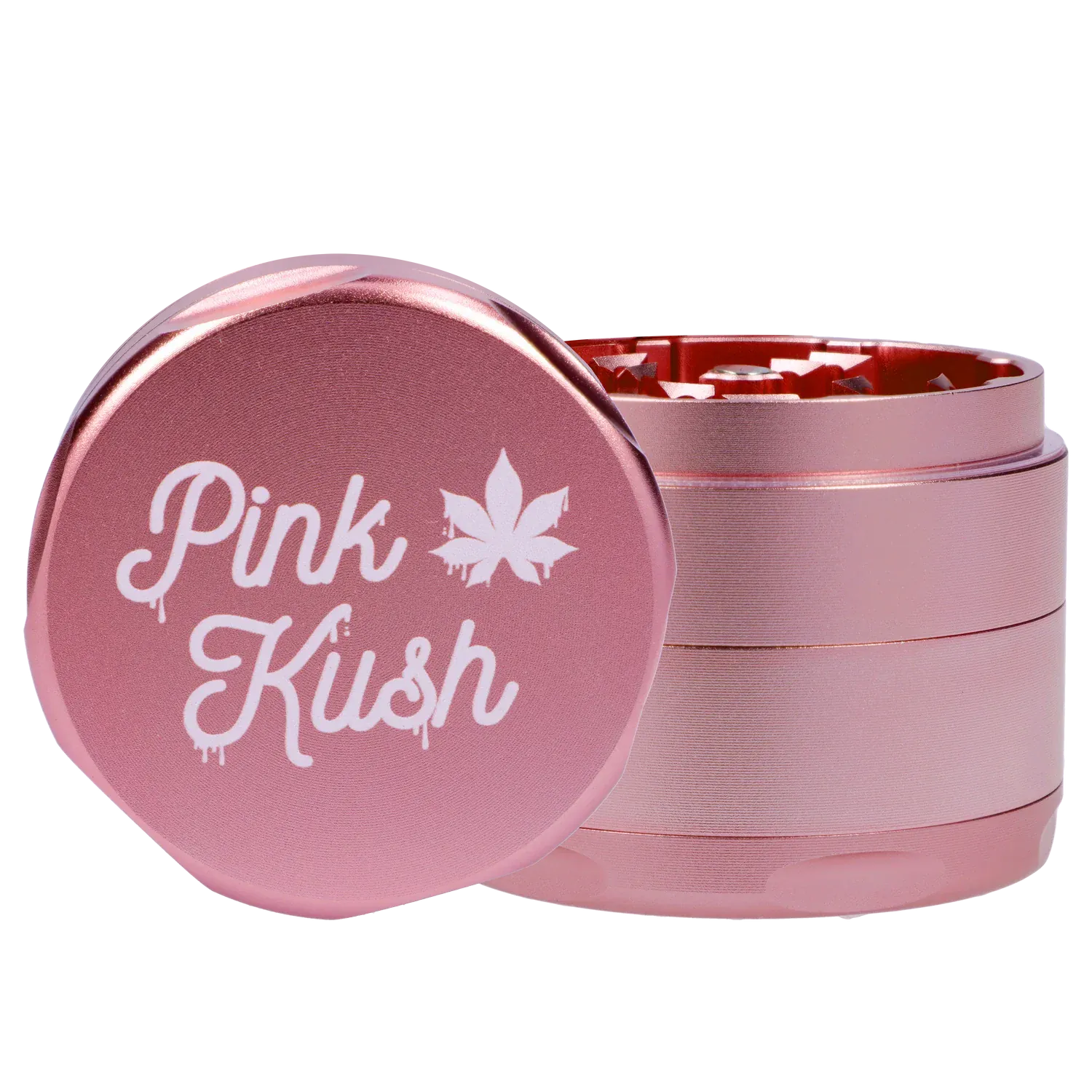 Close-up front view of the Puff Puff Pass Strains Pink Kush Grinder-Light Pink showing the metallic pink lid with white "Pink Kush" script and stacked grinder layers.