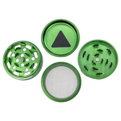 Top-down view of the disassembled green Puff Puff Pass Strains Sour Diesel Grinder-Green showing four circular metal pieces and a fine mesh screen.