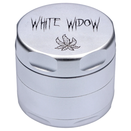 Close-up top-down view of the silver Puff Puff Pass Strains White Widow Grinder-Silver showing engraved "WHITE WIDOW" text and leaf motif.