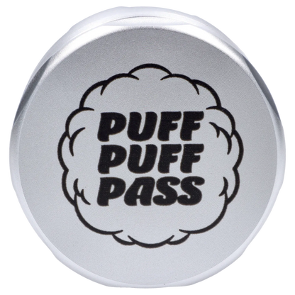 Top-down view of a silver Puff Puff Pass Strains White Widow Grinder-Silver with bold "PUFF PUFF PASS" text inside a cloud graphic on the lid