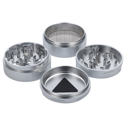 Top-down view of the disassembled Puff Puff Pass Strains White Widow Grinder-Silver showing four silver metal sections, teeth, and a fine mesh screen.