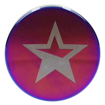 A top-down view of the Famous X - Prism 2 pc Grinder with a rainbow sheen, showcasing its circular shape and polished finish.