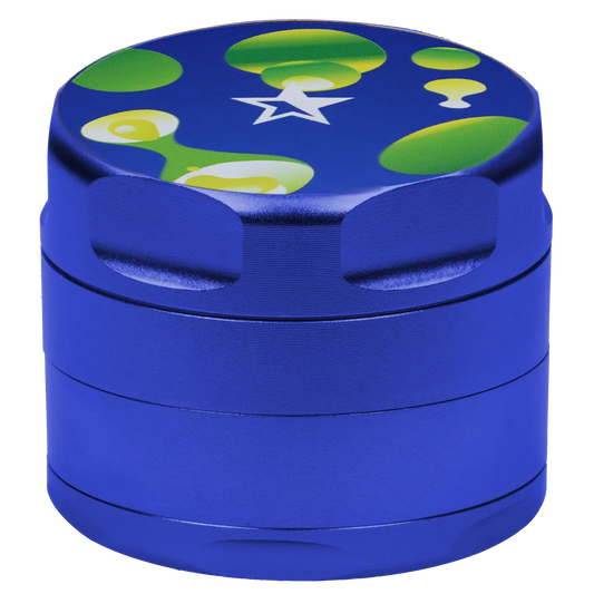 Close-up top-front view of the blue Famous Design Privilege Aluminum 4pc Grinder - Blue showing its textured metal sides and a colorful green and yellow bubble star graphic on the lid