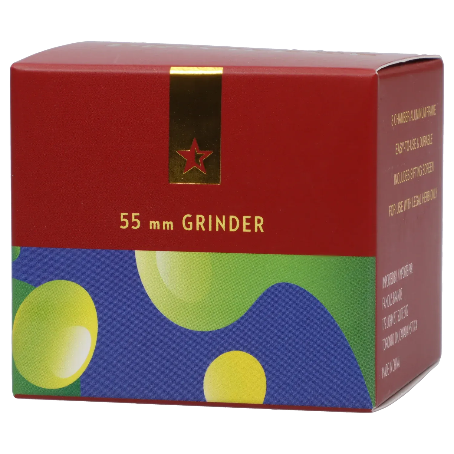 Close-up front view of the Famous Design Privilege Aluminum 4pc Grinder - Blue box showing a red top with gold star emblem and colorful abstract blue and green patterned lower panel
