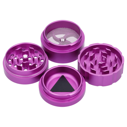 A close-up, angled view of the Atomik Pixelated 55 mm 3-Stage Grinder, showcasing its multi-tiered metallic purple construction.