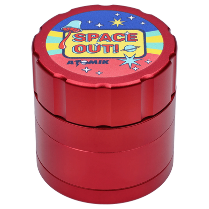 Front view of the Atomik Spaced 55 mm 3-Stage Grinder, a metallic grinder reflecting bright studio lighting.