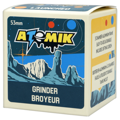 Front view of the Atomik Launched 55 mm 3-Stage Grinder, featuring a blue and silver graphic design on a black background.