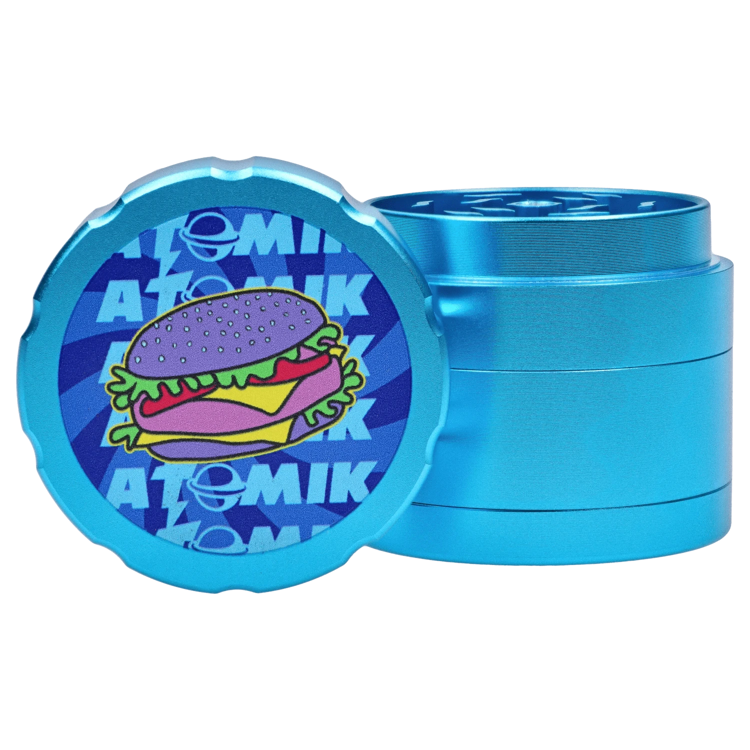 A close-up, angled view of the Atomik Cheesed 55 mm 3-Stage Grinder, showcasing its metallic, tiered construction.