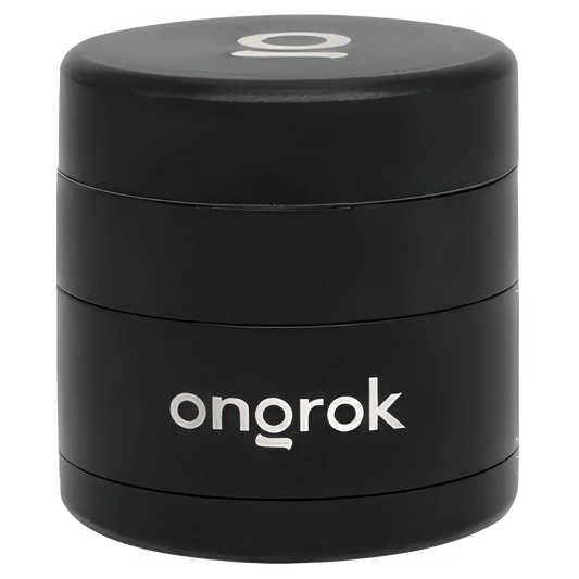 A close-up of the black, four-piece Ongrok Mini 4 Piece EZ Grinder, showcasing its cylindrical shape and metallic teeth.