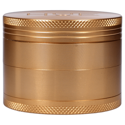 Front view of the Hue 3-Stage Grinder in champagne gold, showing its textured, cylindrical design.