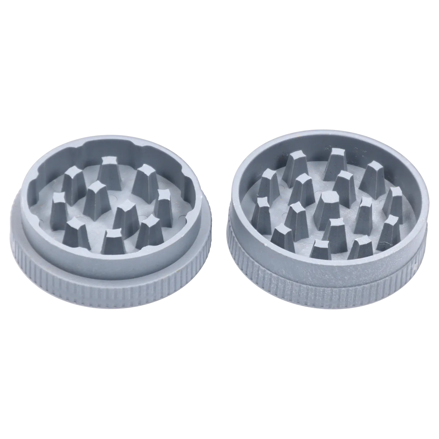 Top-down view of two grey pieces of the Ongrok - Degradable Grinder - 24/box Assorted Colours showing internal teeth and textured outer rims.