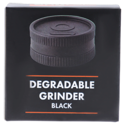 Close-up front view of a black plastic grinder pictured on the packaging for Ongrok - Degradable Grinder - 24/box Assorted Colours.