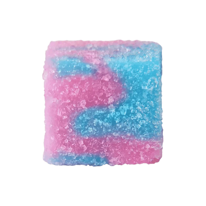 Close-up top view of a square, sugar-coated gummy in pink and blue tones from Glenn's No. 16 Rosin Cotton Clouds Gummies.