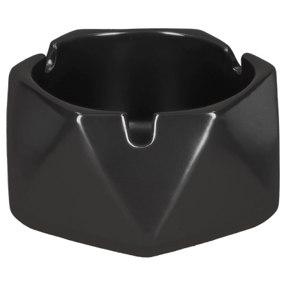 Front-facing close-up of the Valiant Hexagonal Glass Ashtray - Black - 4.4in showing its glossy black hexagonal rim, central notch, and deep bowl.