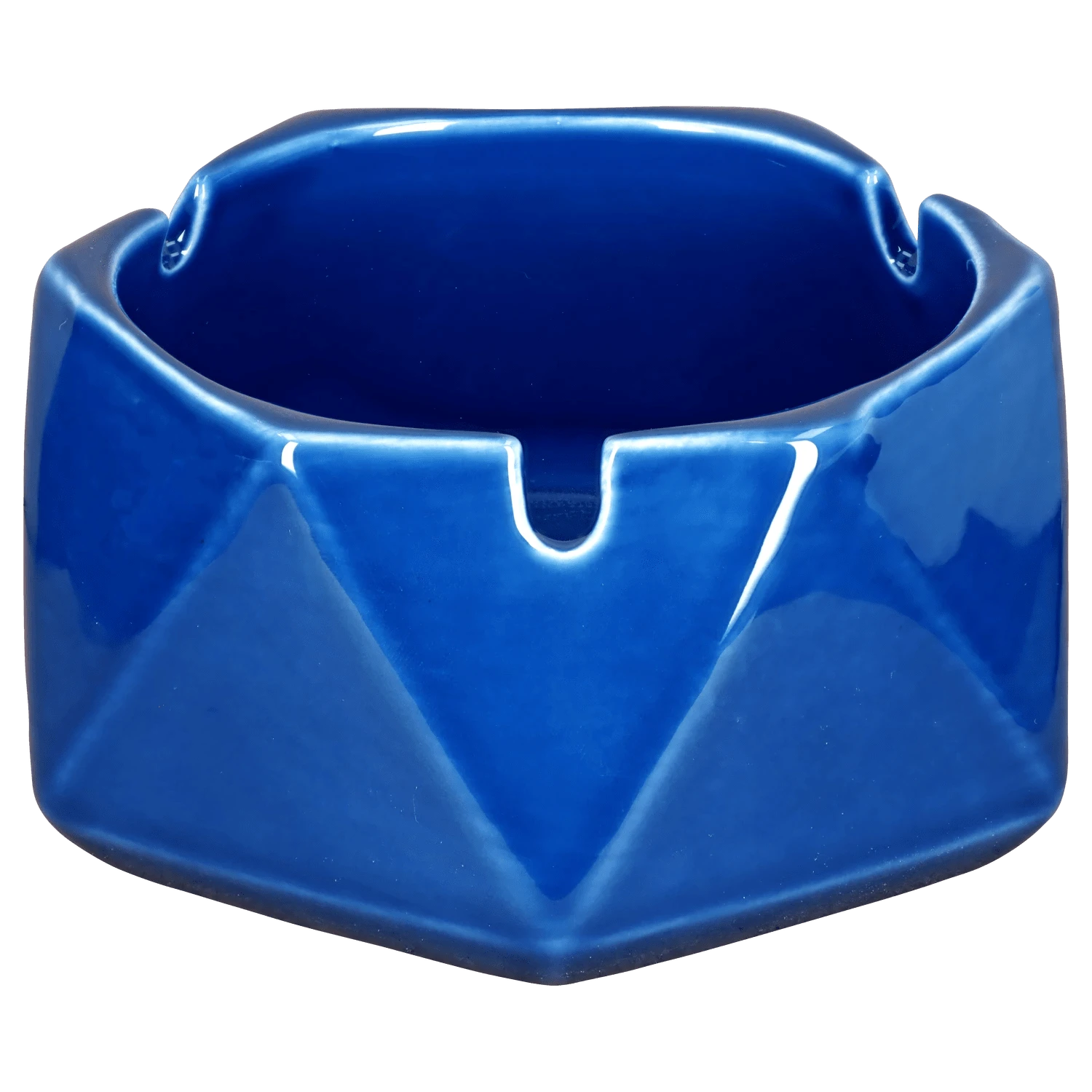 A teal, hexagonal Valiant Hexagonal Glass Ashtray - Teal - 4.4in, captured in a close-up, angled shot emphasizing its smooth, glass construction.