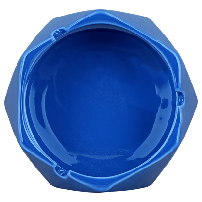 A top-down view of the teal 4.4in Valiant Hexagonal Glass Ashtray, showcasing its geometric shape and smooth glass surface.