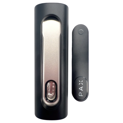 Close-up top-down view of the Onyx PAX Flow Dry Herb Vaporizer – Onyx showing the matte black body and metallic mouthpiece insert next to the slim branded battery cap.
