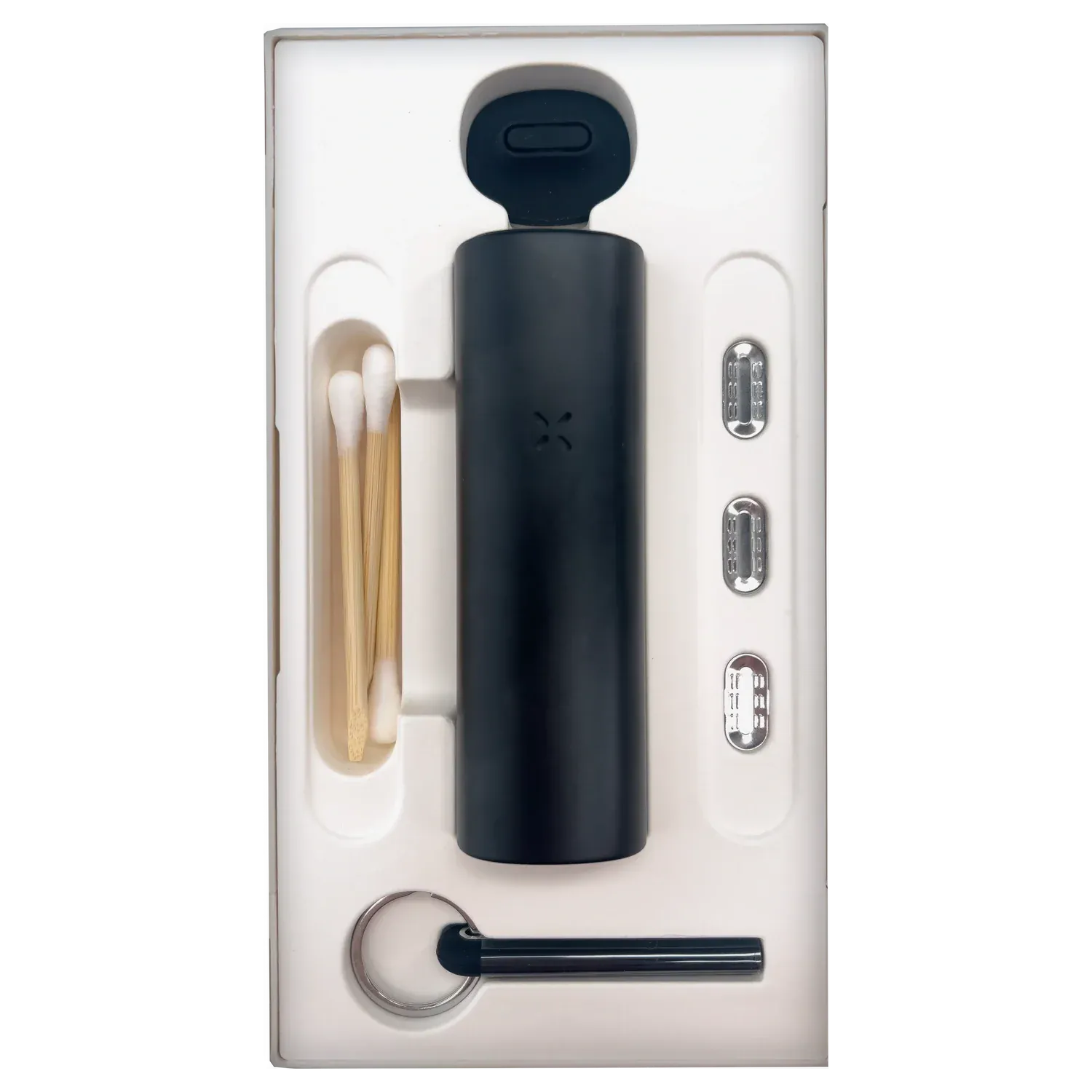 Top-down view of the PAX Flow Dry Herb Vaporizer – Onyx nestled in white molded packaging alongside cotton swabs, metal pods, and a keyring tool.