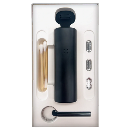 Top-down view of the PAX Flow Dry Herb Vaporizer – Onyx nestled in white molded packaging alongside cotton swabs, metal pods, and a keyring tool.