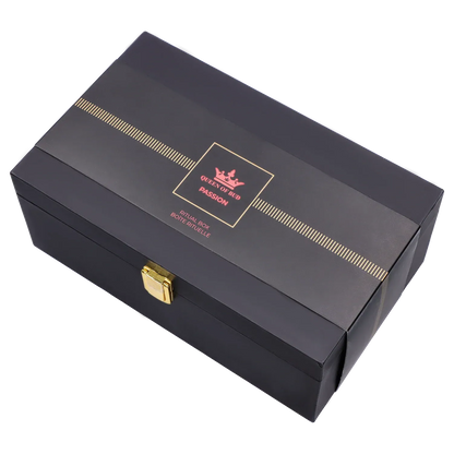Angled top view of the black Queen of Bud: Passion Ritual Box – Candle, Zippo, and Crystal with gold trim, central pink logo, and brass latch
