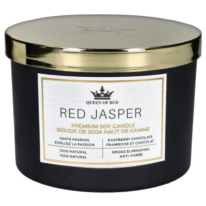 Close-up front view of the Queen of Bud: Passion Ritual Box – Candle, Zippo, and Crystal showing the black jar with a gold lid and a white "Red Jasper" label.