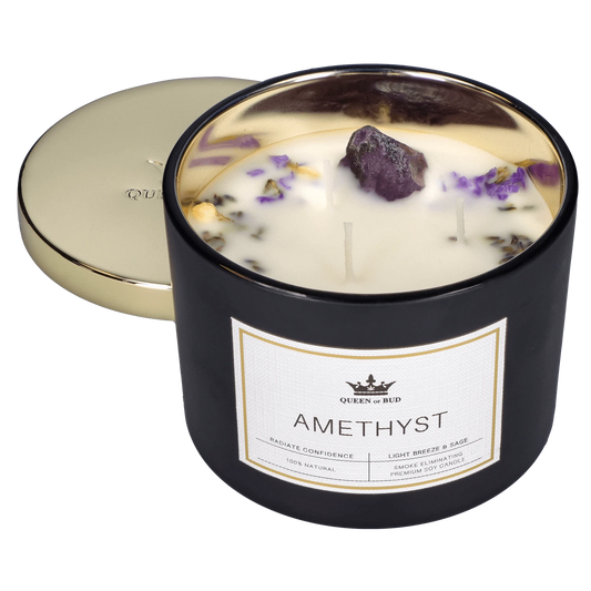 Front view of the lit Queen of Bud Candle - Amethyst, showcasing the glowing wax pool within its glass container.