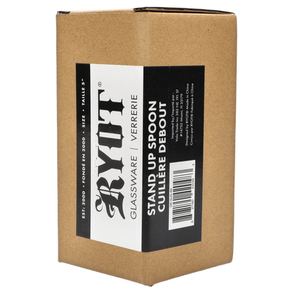 A close-up shot of the RYOT - Stand Up Spoon, showing its sleek design against a dark background.