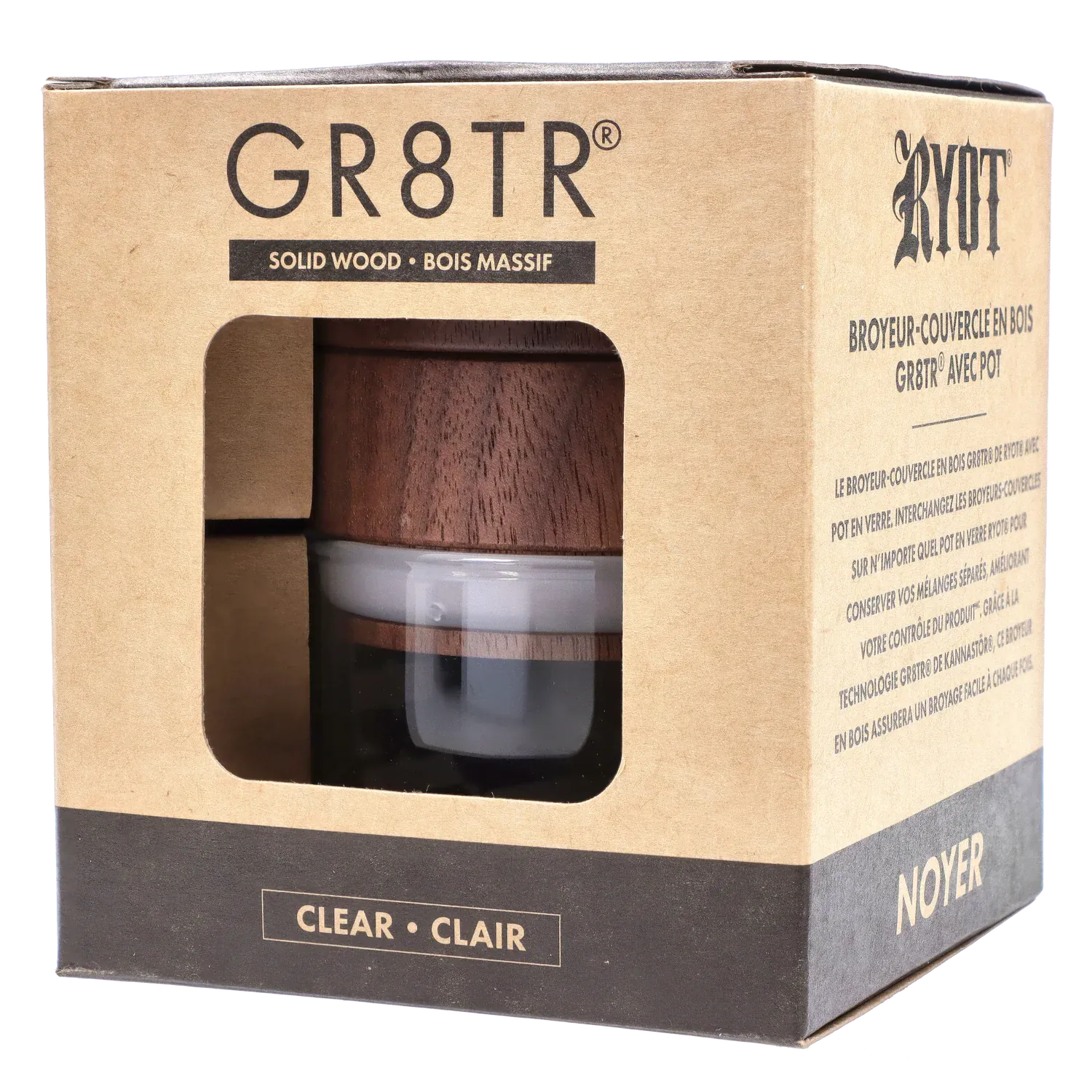 Angled close-up of the RYOT - GR8TR Walnut Wood Top Grinder w/ Clear Glass Jar Body - 3 inch visible through its cardboard window.
