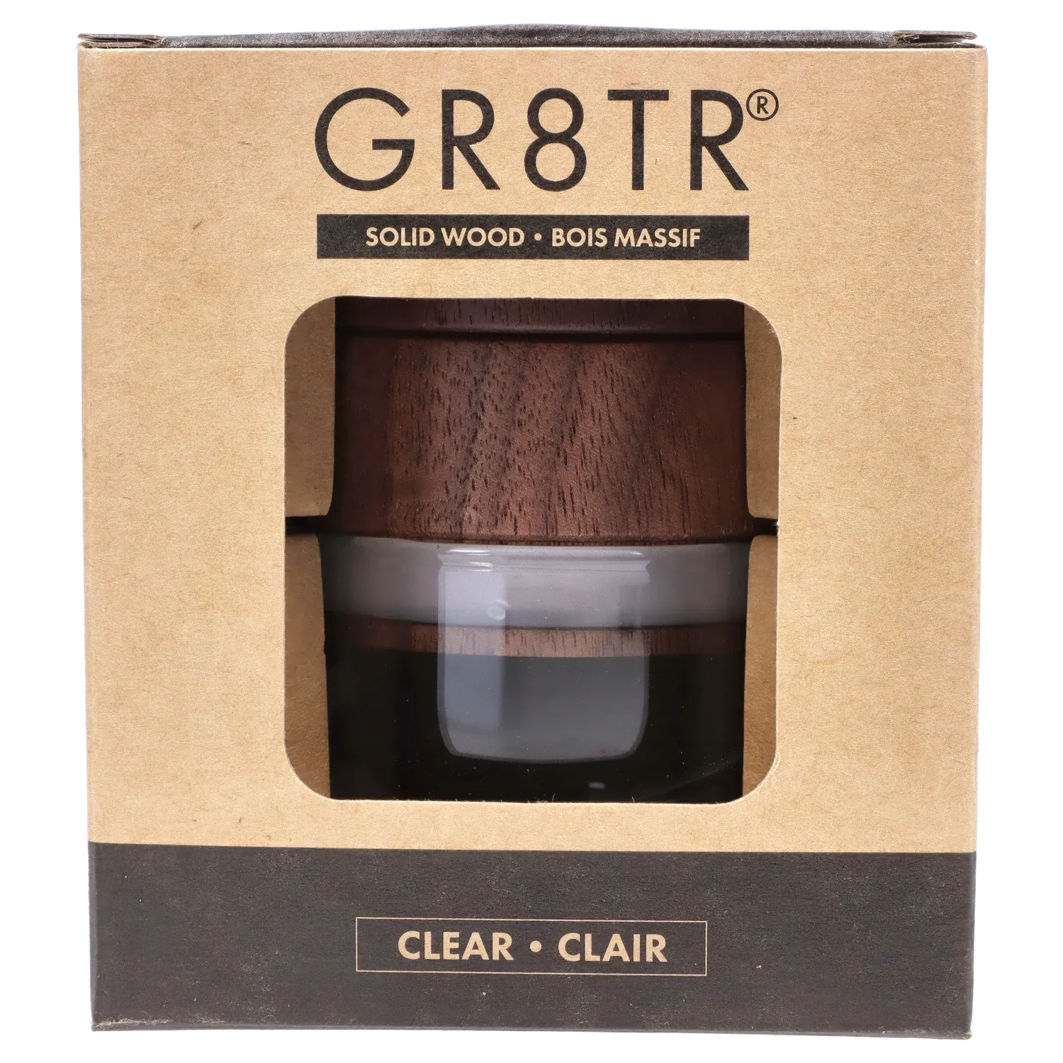 Close-up front view through the window of the RYOT - GR8TR Walnut Wood Top Grinder w/ Clear Glass Jar Body - 3 inch showing the dark walnut wood top and clear glass jar inside its cardboard packaging.