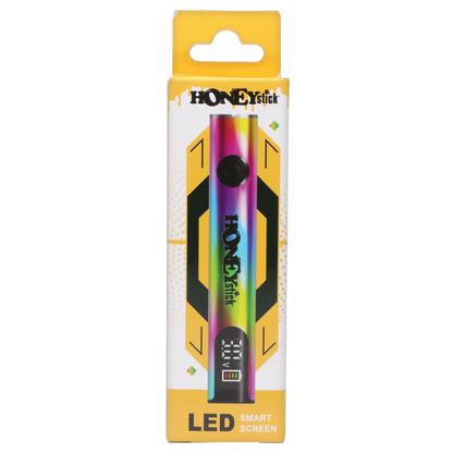 Top-down view of the rainbow-finish HoneyStick Digital Battery - Multi Carton centered on yellow and white branded packaging with an LED display at the base.