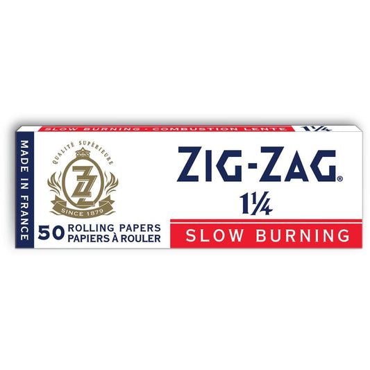 A close-up of Zig Zag White Rolling Papers – 1 ¼, displaying the branded packaging with a classic red and white design.
